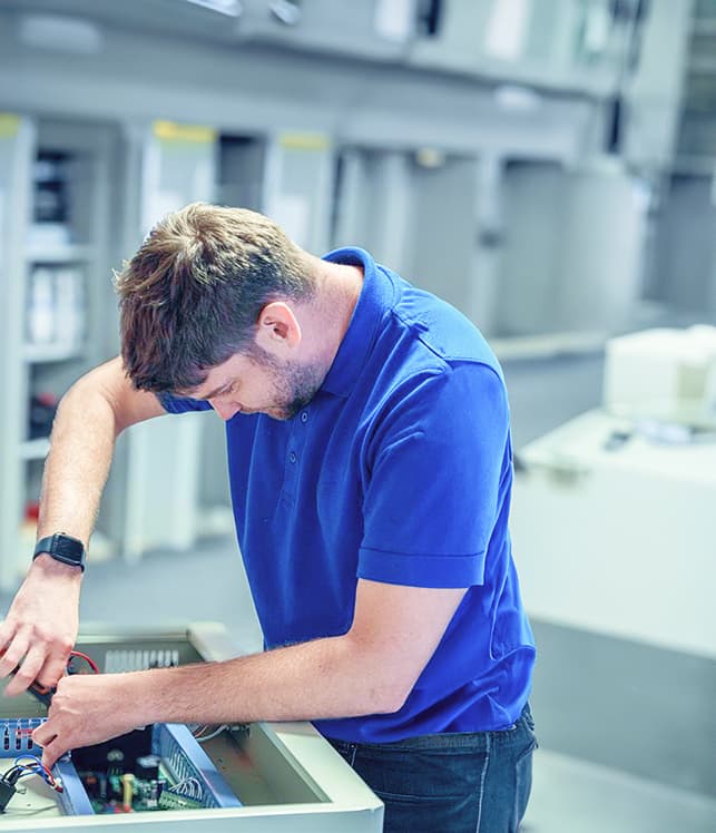 Technician repairing electronic equipment.